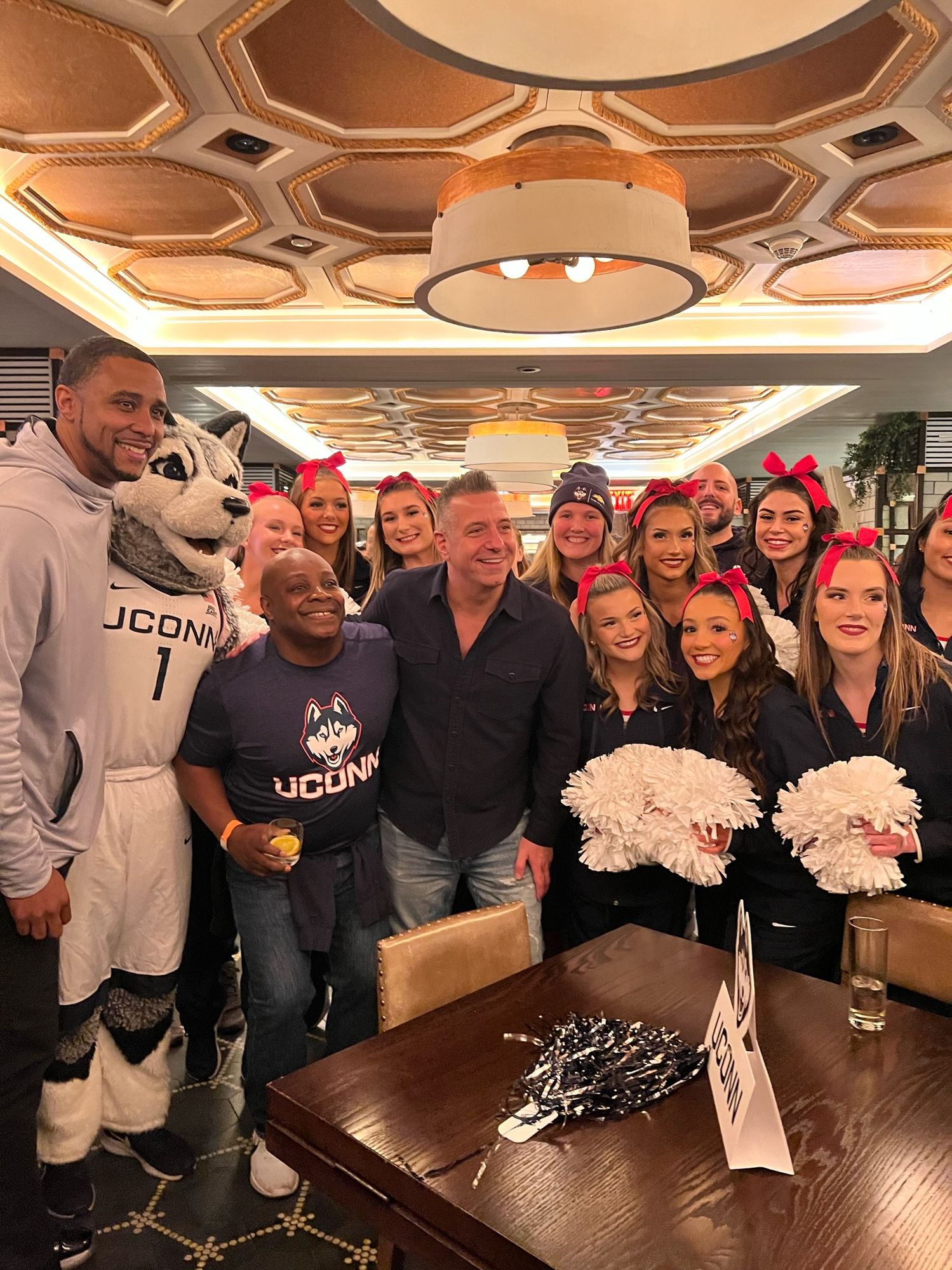 Marc D'Amelio with UConn athletes, Jonathan the Husky mascot, and UConn cheerleaders at an early D'Amelio Huskies Collective gathering