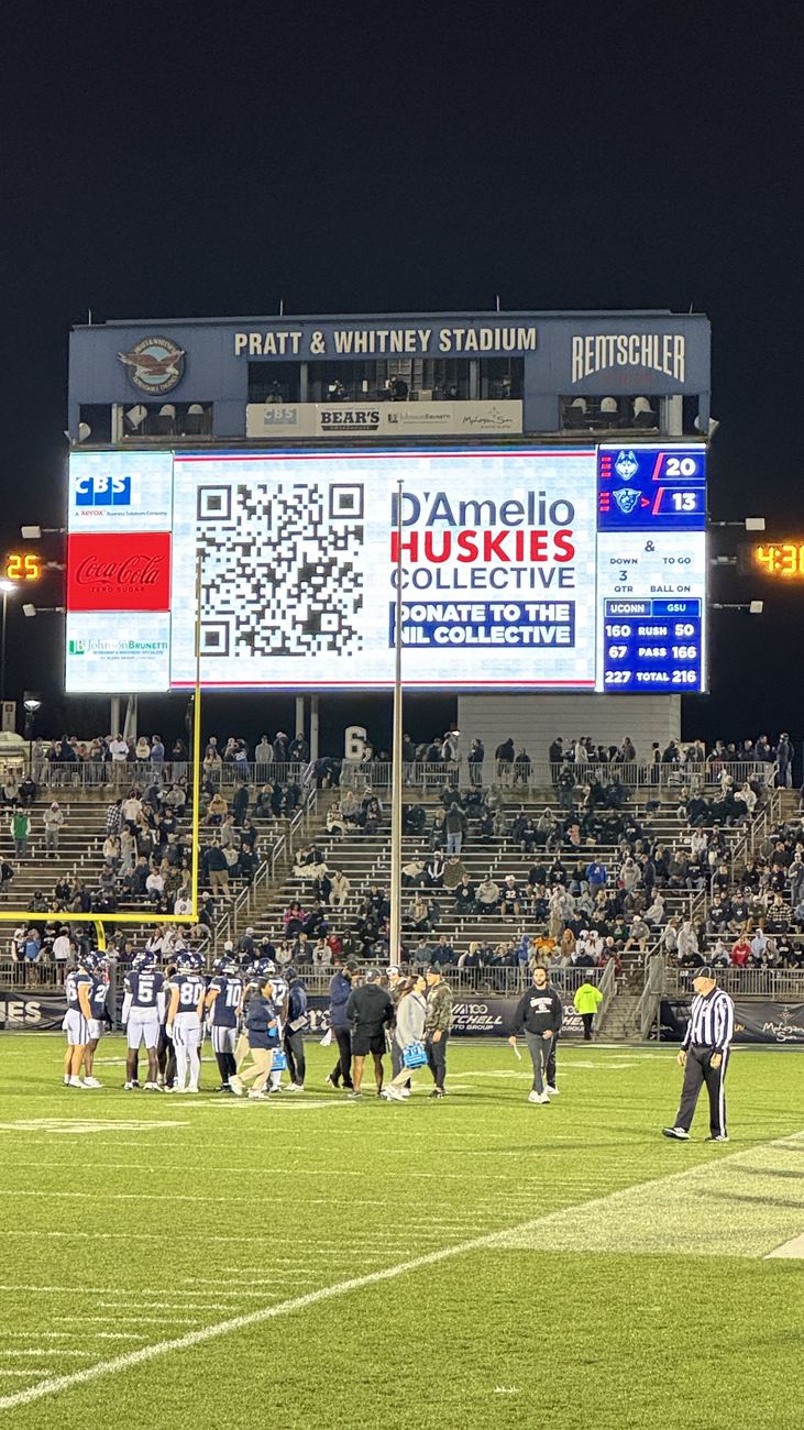 D'Amelio Huskies Collective on the scoreboard at Pratt and Whitney Stadium