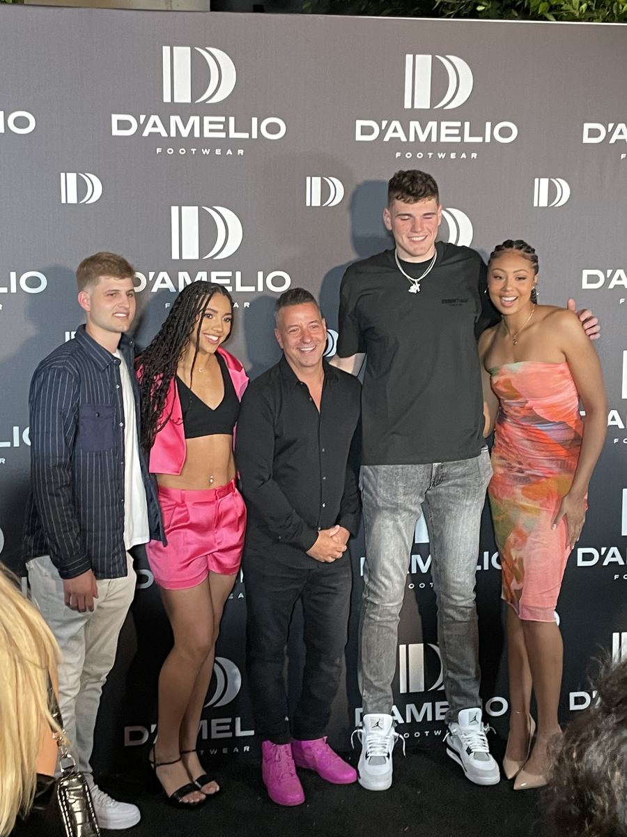 Marc D'Amelio at the D'Amelio Footwear launch party with a UConn Men's Basketball player