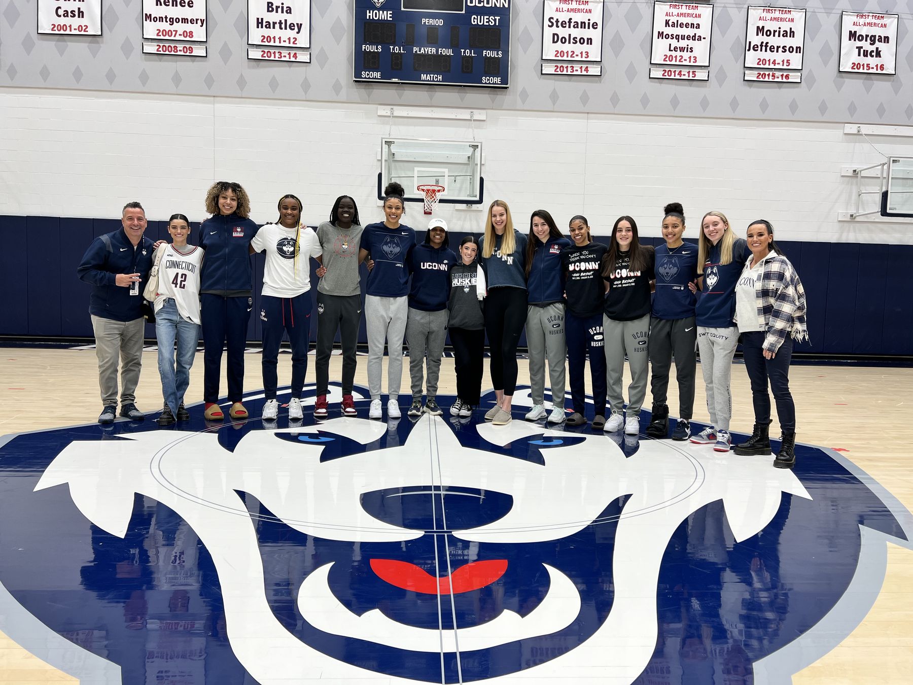 UConn Women's Basketball players and staff at center court, Gampel Pavilion